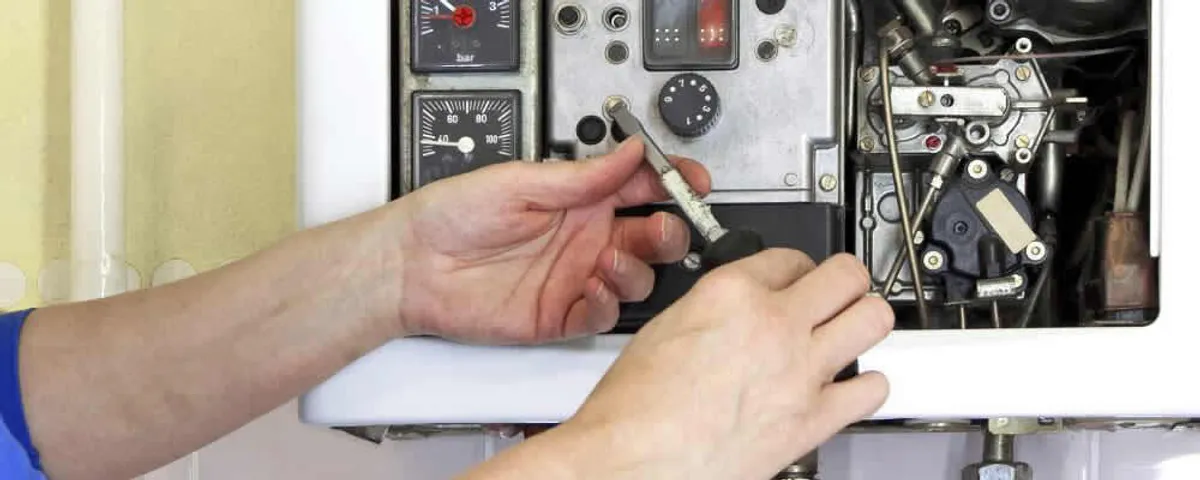 Heating repair technician adjusting boiler controls and components in Allen, TX