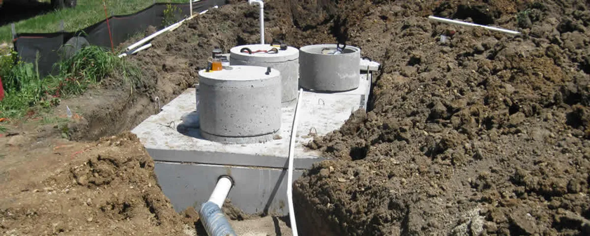 Septic system repair and installation site with tank access ports in Allen, TX